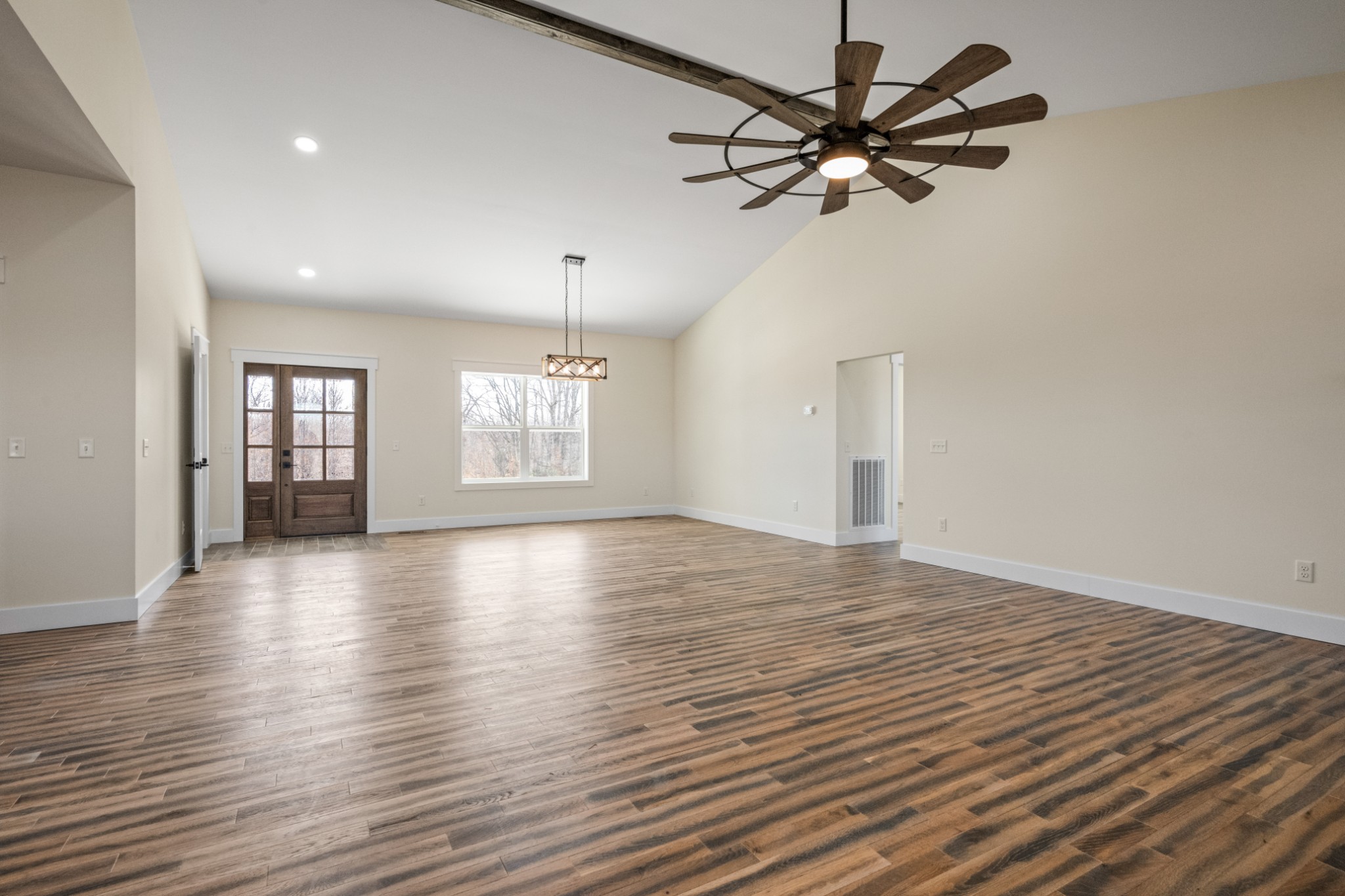 9345 Fox Hill Road Baxter, TN 38544 - Photo 20 of 54 a view of an empty room with a window and wooden floor