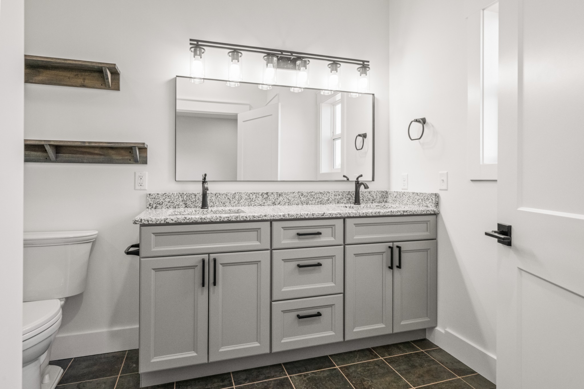 9345 Fox Hill Road Baxter, TN 38544 - Photo 34 of 54 a bathroom with a granite countertop sink and a mirror