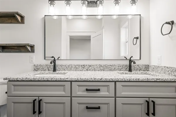 a view of a room with wooden floor and window