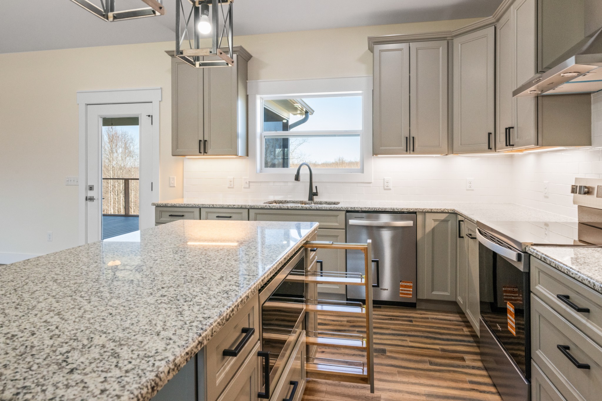 9345 Fox Hill Road Baxter, TN 38544 - Photo 4 of 54 a kitchen with granite countertop a sink and cabinets