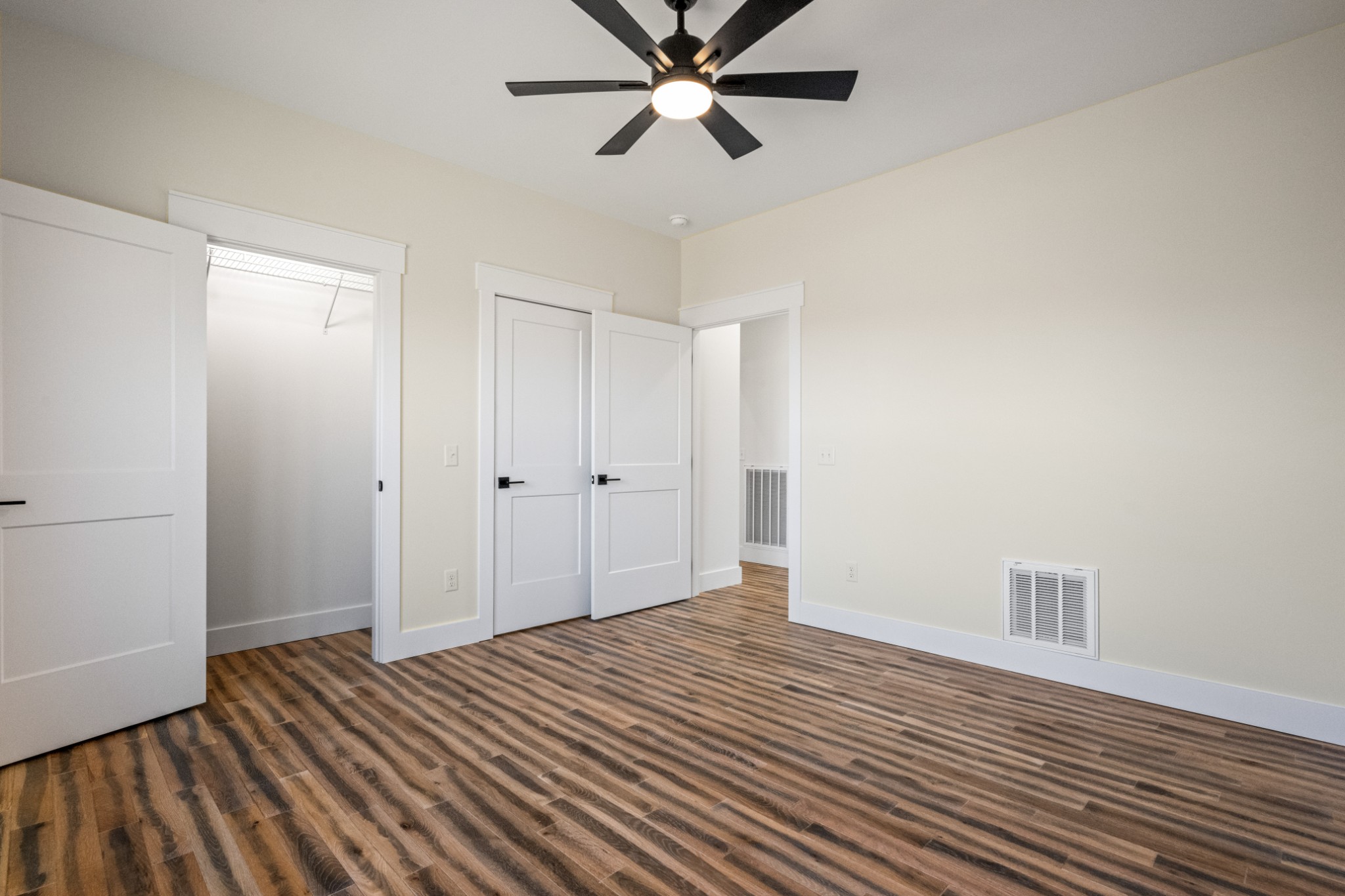 9345 Fox Hill Road Baxter, TN 38544 - Photo 41 of 54 a view of a room with wooden floor and a ceiling fan