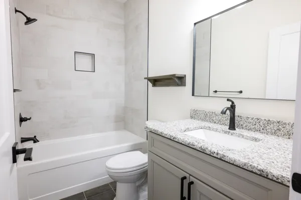 a bathroom with a sink and a shower