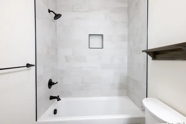 an empty room with projector & cabinets