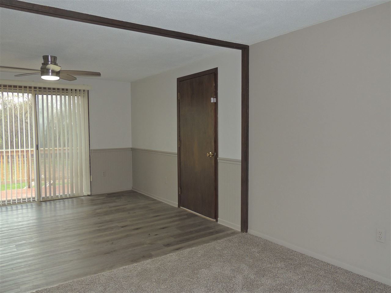 11634 Crockett Road Roscoe, IL 61073 - Photo 11 of 26 a view of an empty room with wooden floor