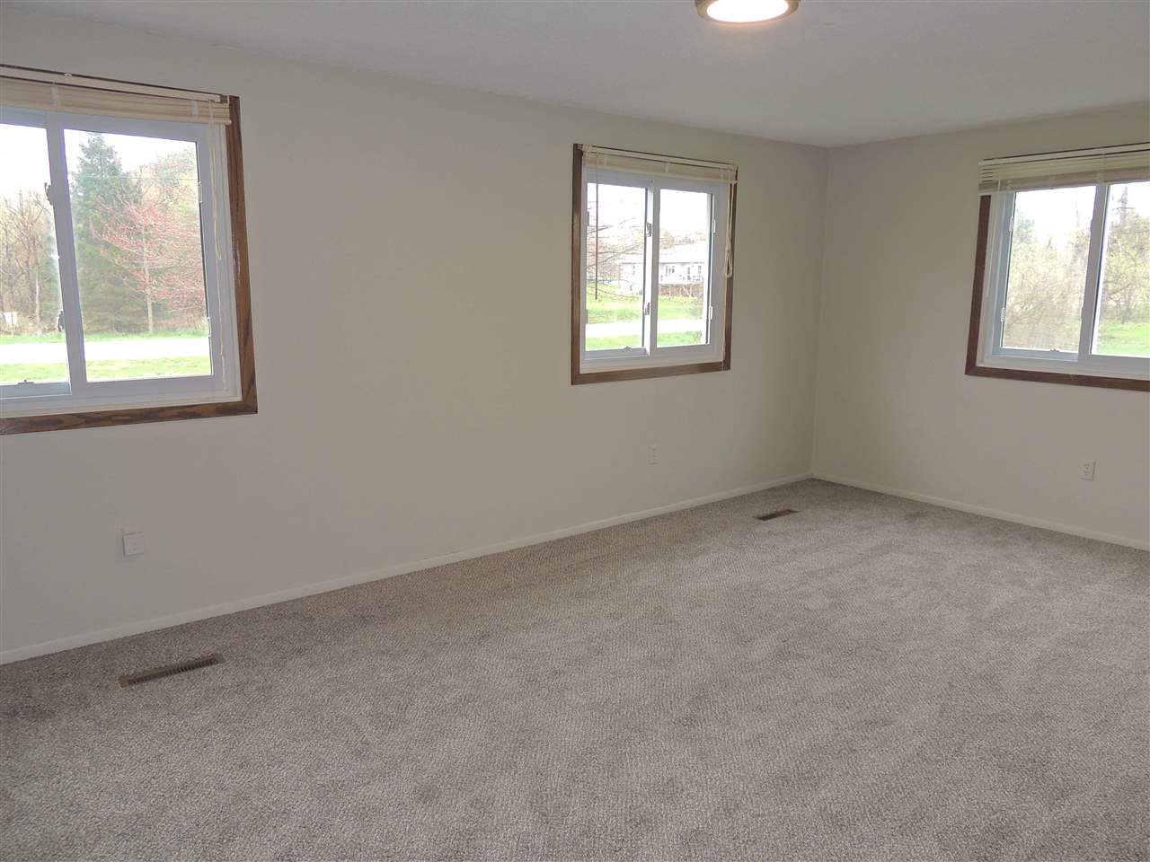 11634 Crockett Road Roscoe, IL 61073 - Photo 16 of 26 an empty room with windows