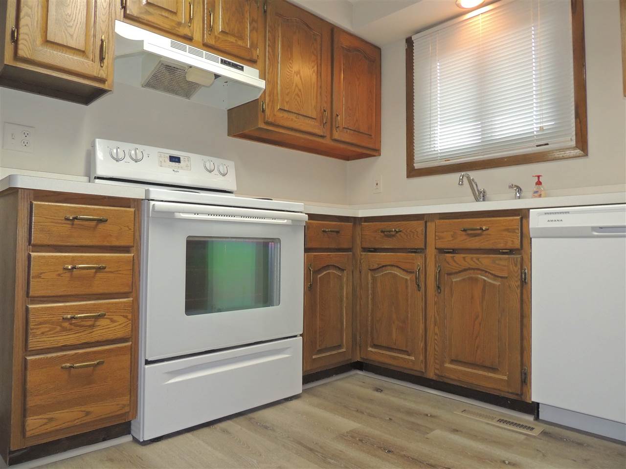11634 Crockett Road Roscoe, IL 61073 - Photo 8 of 26 a utility room with granite countertop cabinets washer and dryer