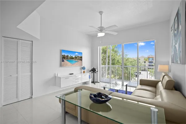 a living room with furniture and a window