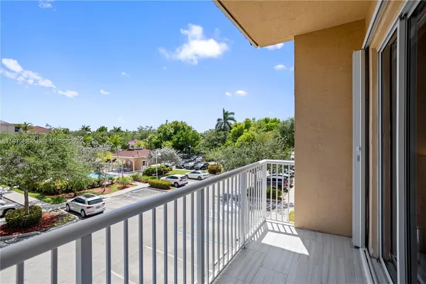 a view of a balcony with wooden floor