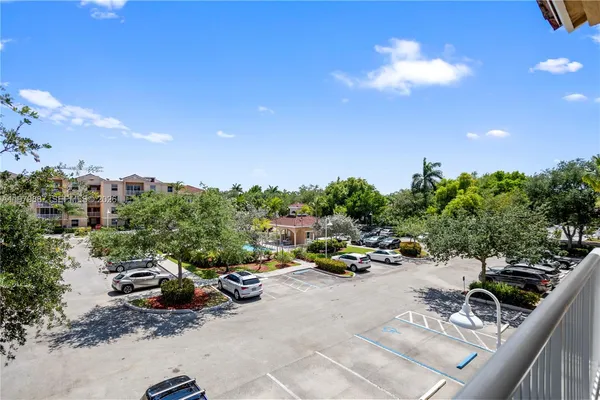 a view of a terrace with lawn chairs and couches
