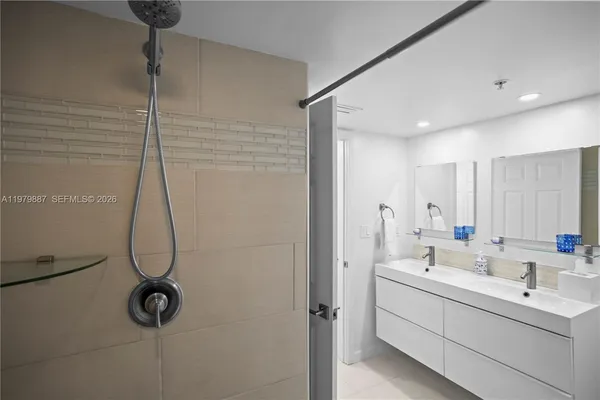 a bathroom with a sink and mirror