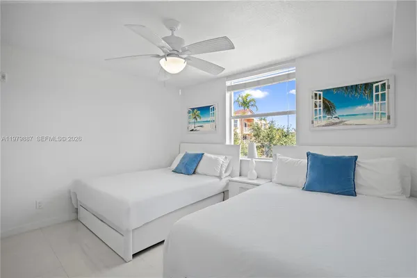 a bedroom with bed and window