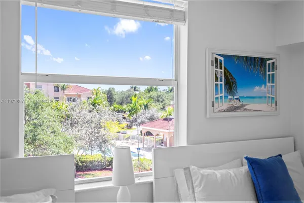 a view of a living room with a large window