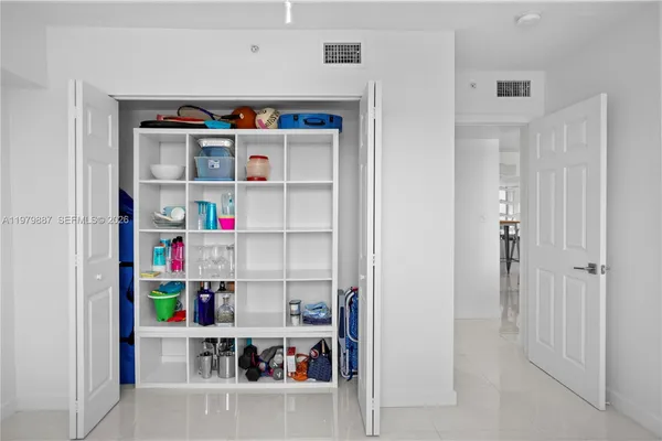 a shelf with books and knick knacks on it