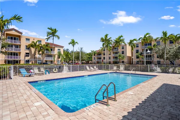 a view of a swimming pool with a patio