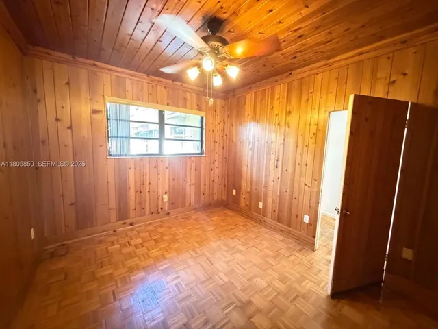 an empty room with windows and entrance