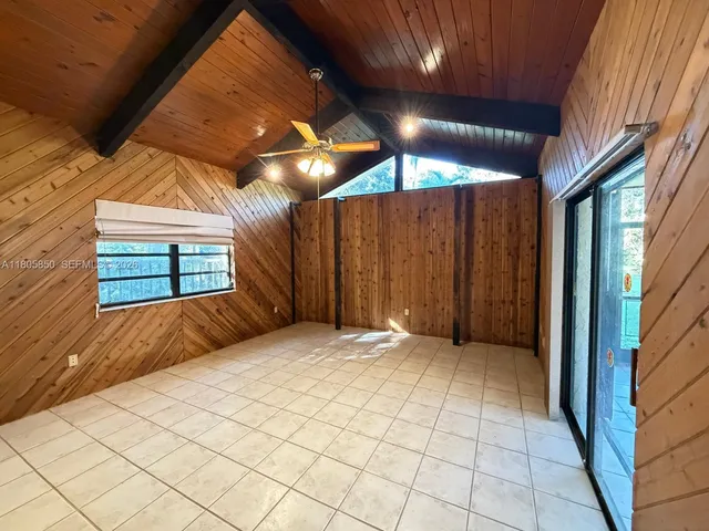 a view of backyard with brick walls