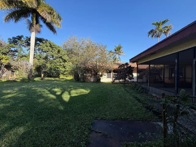 a view of a house with a garden