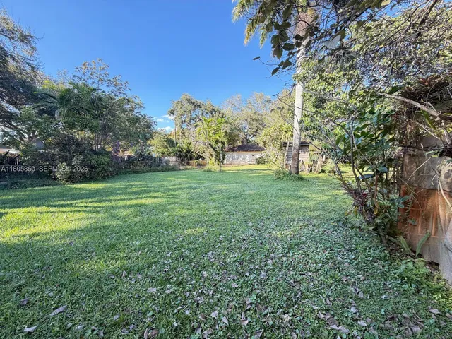 a backyard of a house with lots of green space