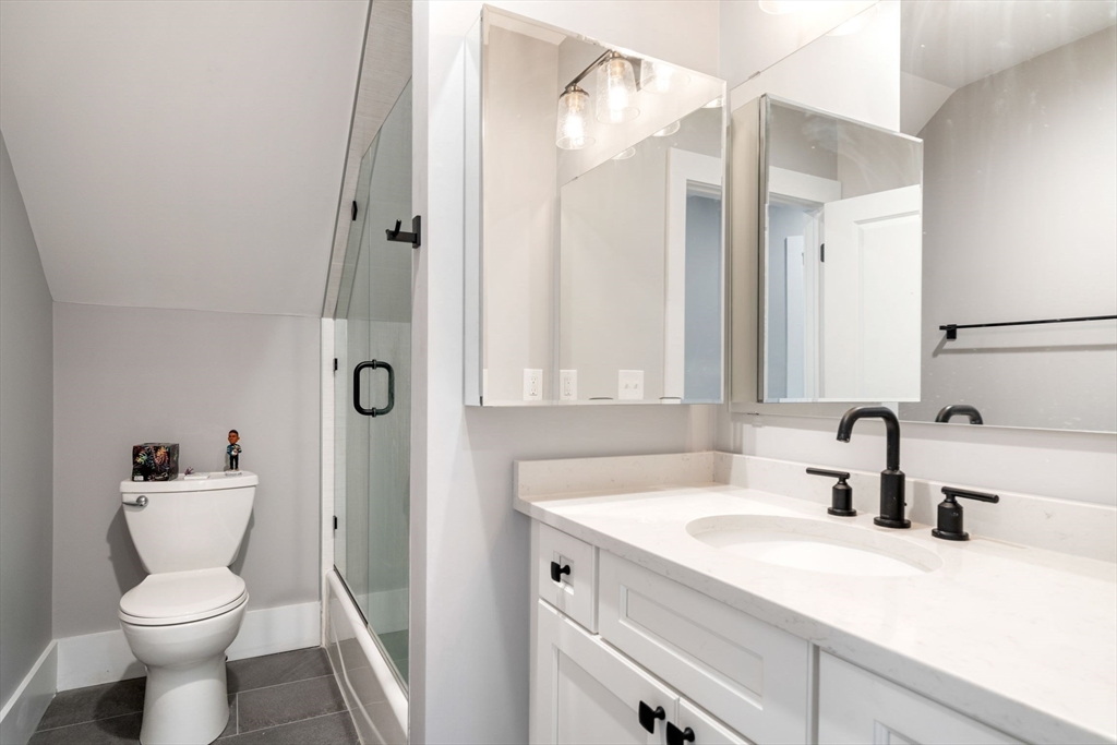18 Harding Terrace Dedham, MA 02026 - Photo 18 of 38 a bathroom with a sink a toilet and a mirror