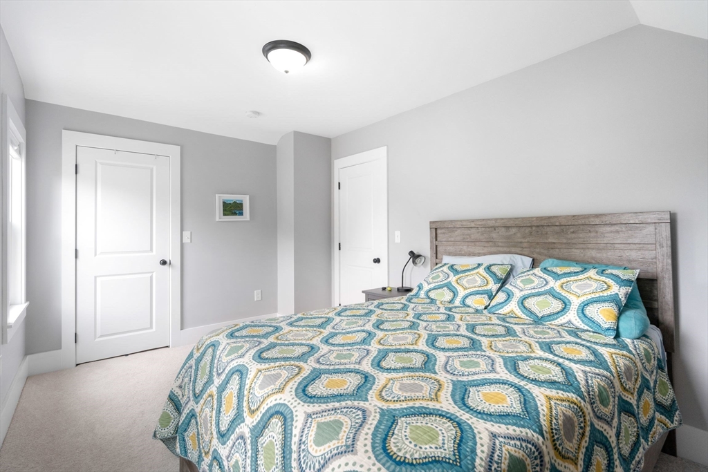 18 Harding Terrace Dedham, MA 02026 - Photo 19 of 38 a bedroom with a bed and a window