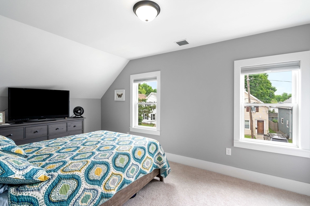 18 Harding Terrace Dedham, MA 02026 - Photo 20 of 38 a bedroom with a bed and a flat screen tv