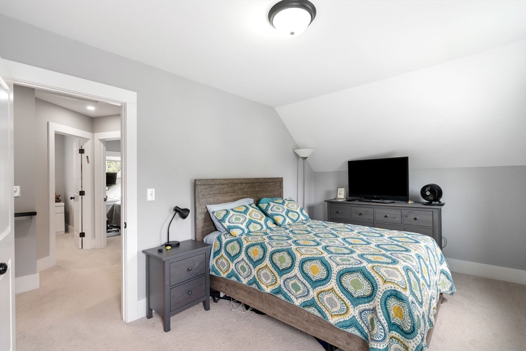 18 Harding Terrace Dedham, MA 02026 - Photo 21 of 38 a bedroom with a bed and a television