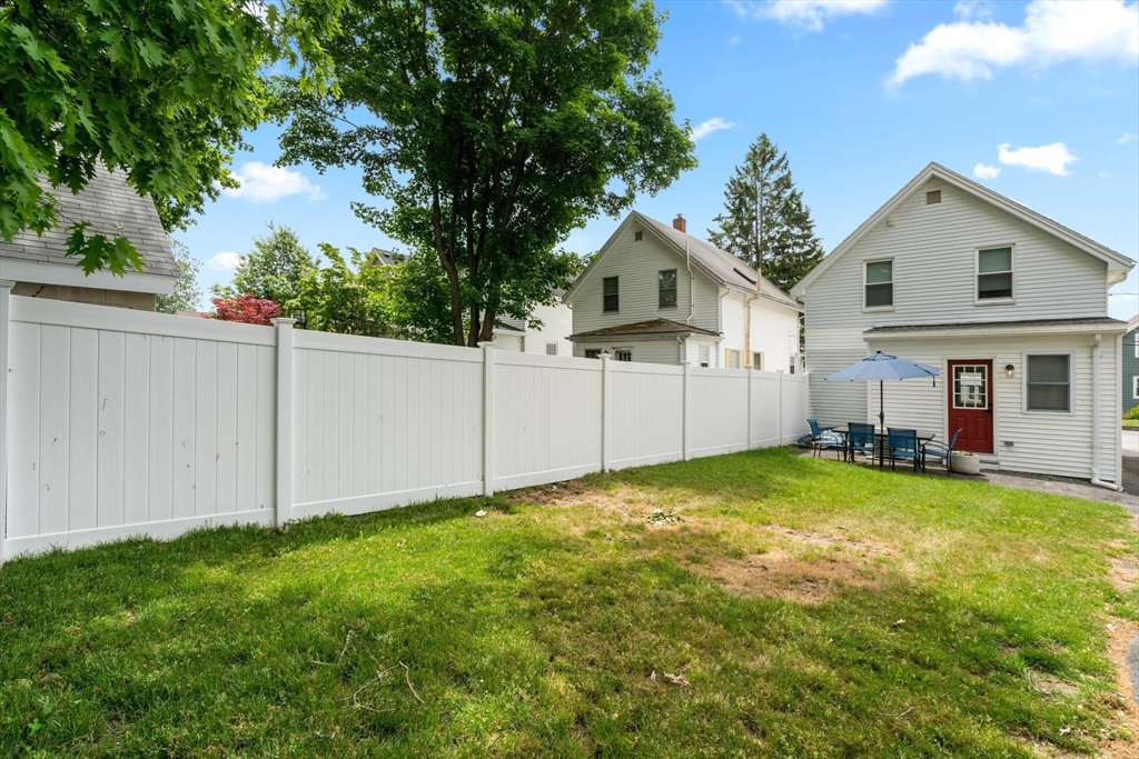 18 Harding Terrace Dedham, MA 02026 - Photo 30 of 38 a view of a house with a yard and garage