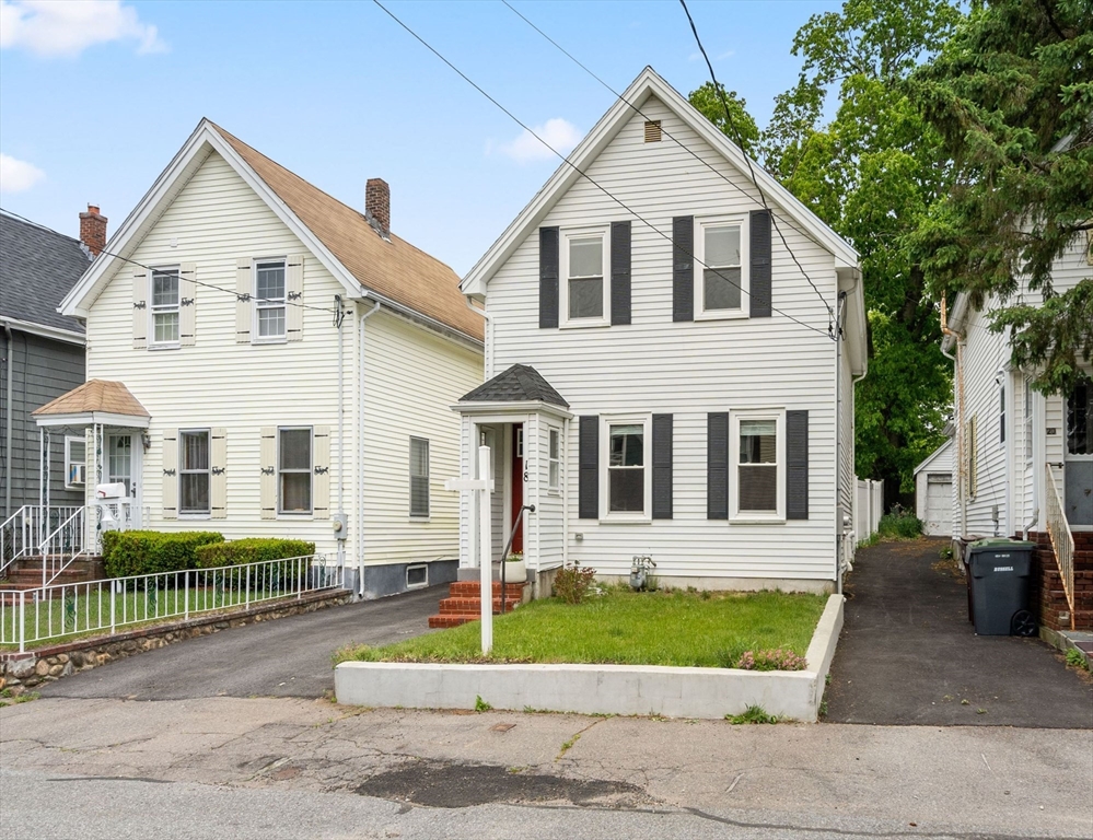 18 Harding Terrace Dedham, MA 02026 - Photo 35 of 38 a view of a white house with large windows and a yard