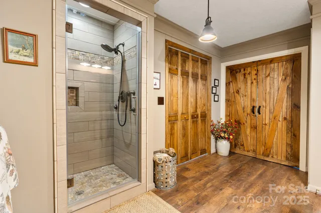 a bathroom with a shower and a sink