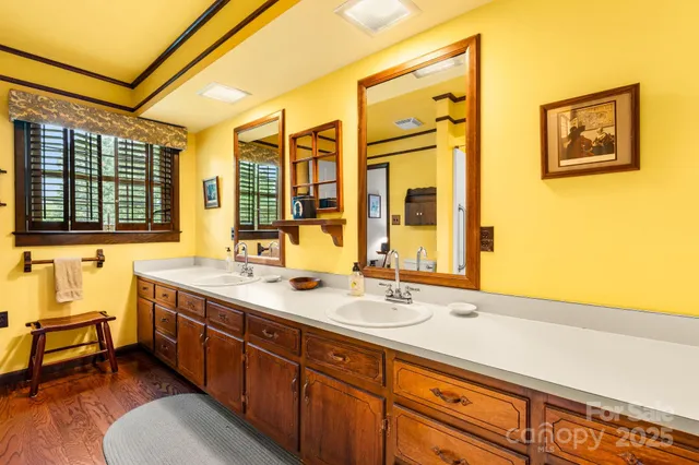 a bathroom with a granite countertop sink mirror and double