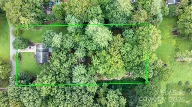 a view of a garden with a building