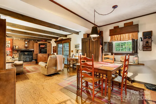 a outdoor space with lots of white furniture and a chandelier