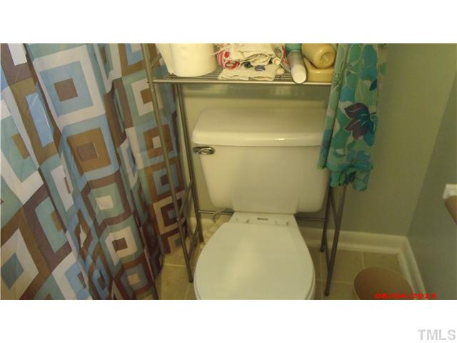629 Coleman Street Raleigh, NC 27610 - Photo 15 of 25 a bathroom with a sink and toilet