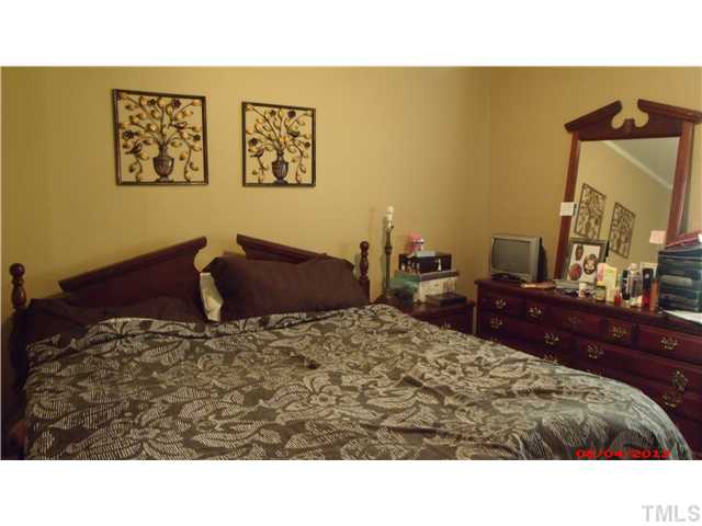 629 Coleman Street Raleigh, NC 27610 - Photo 17 of 25 a living room with a bed