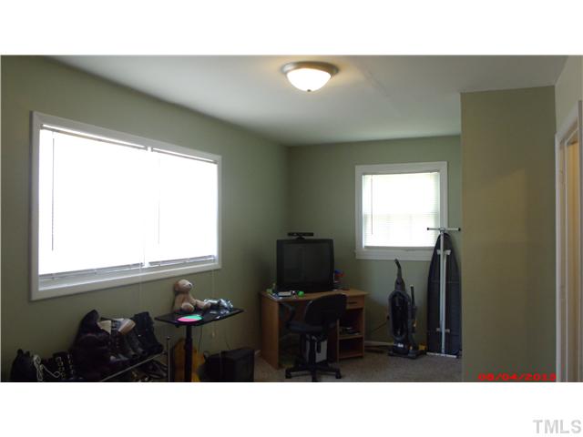629 Coleman Street Raleigh, NC 27610 - Photo 21 of 25 a kitchen with a sink cabinets and a window