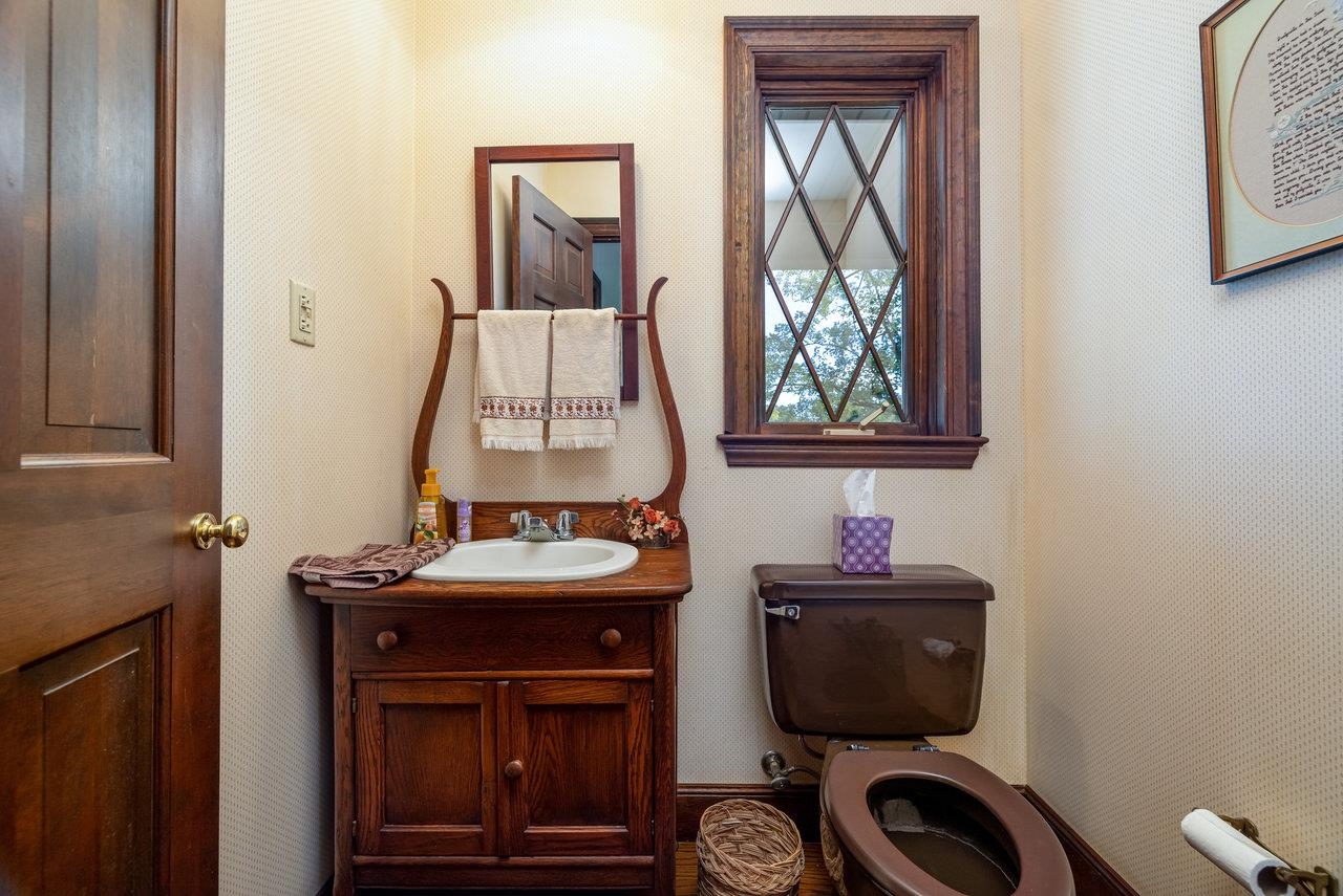223 Fadley Road Weyers Cave, VA 24486 - Photo 23 of 59 a bathroom with a toilet sink and mirror