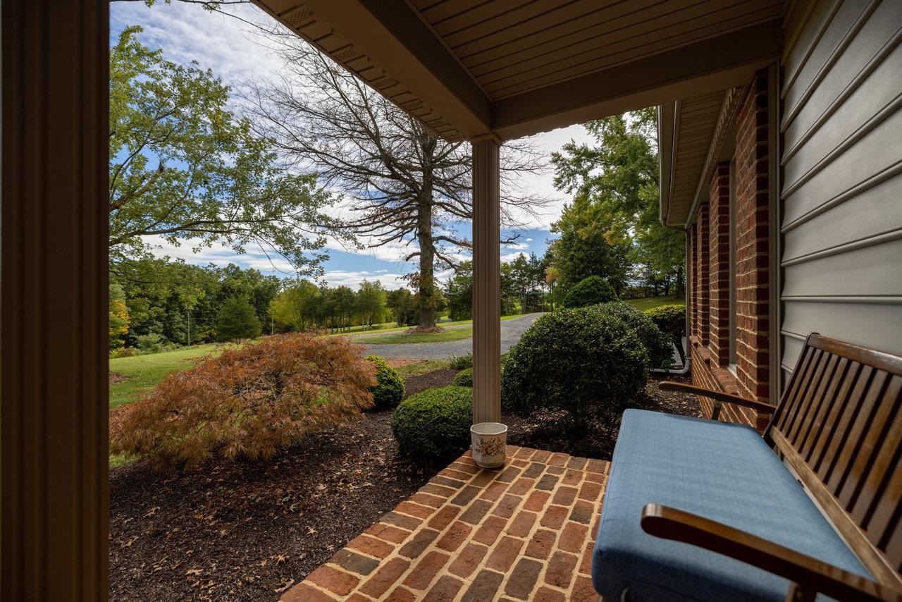 223 Fadley Road Weyers Cave, VA 24486 - Photo 4 of 59 a view of a patio with a table chairs and a backyard