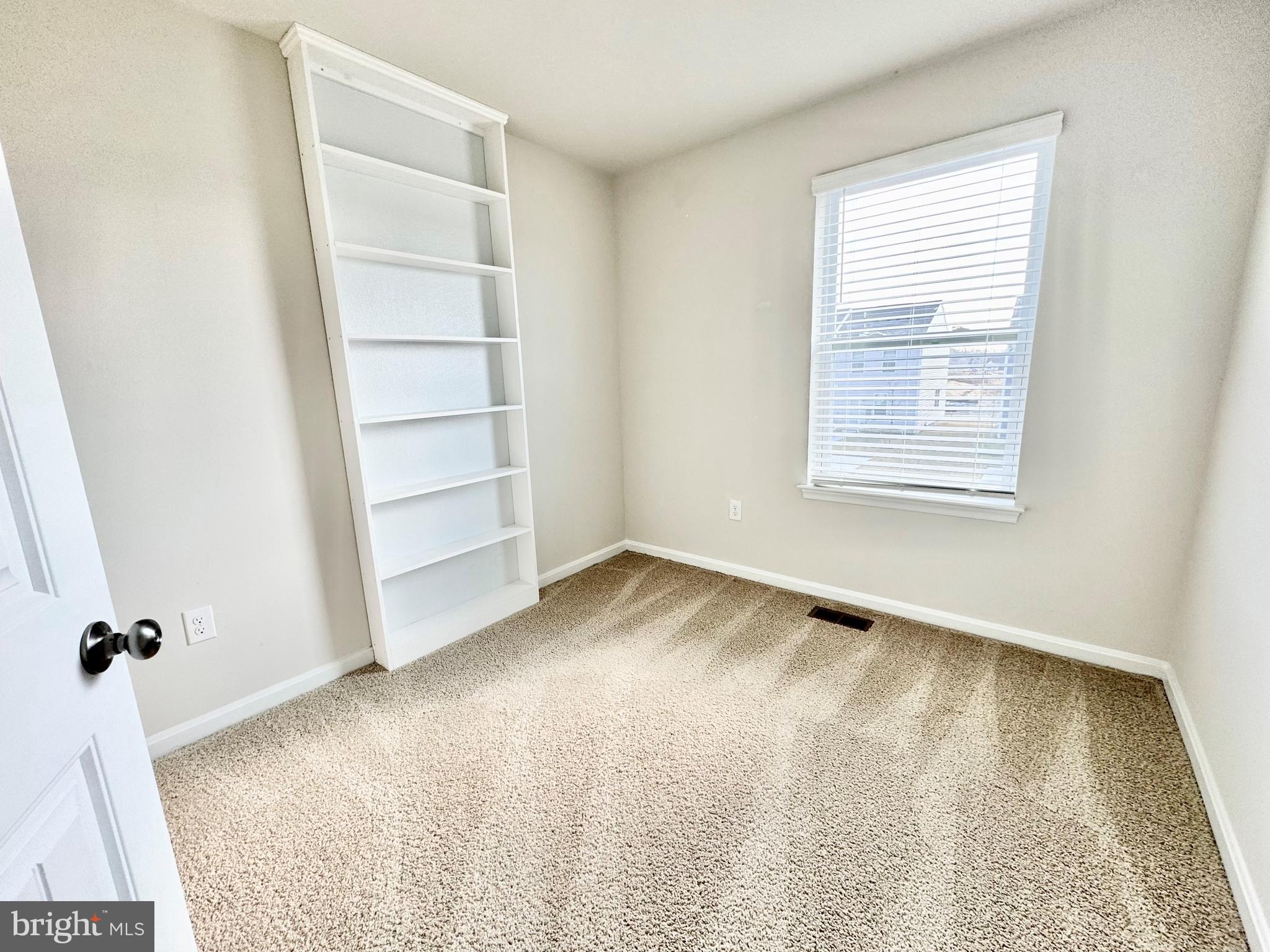 516 Ridgley Boulevard Dover, DE 19904 - Photo 16 of 18 an empty room with a empty space and a window