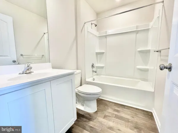 a bathroom with a sink a toilet and a bathtub