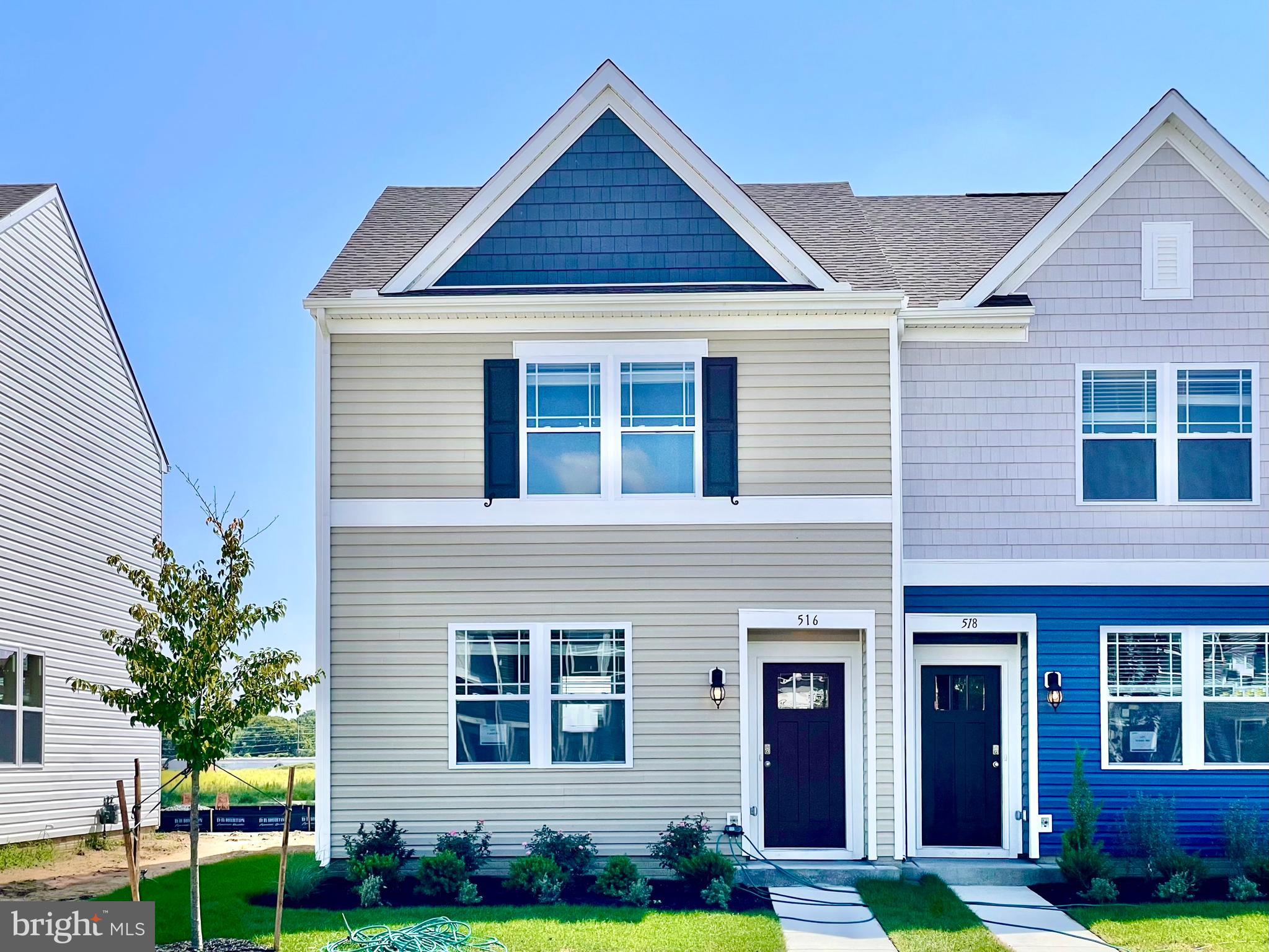 516 Ridgley Boulevard Dover, DE 19904 - Photo 2 of 18 a front view of a house with yard and glass windows