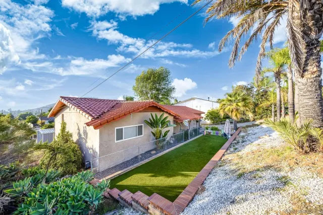 a aerial view of a house with a yard