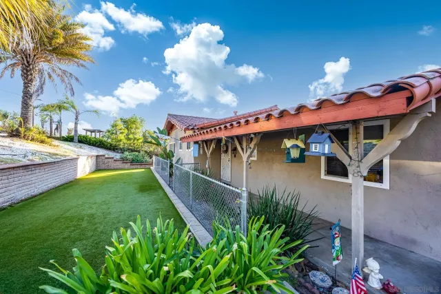 a view of a backyard with a patio