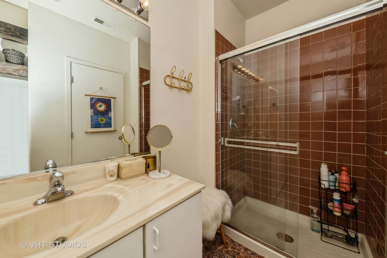 811 South Lytle Street, Unit 412 Chicago, IL 60607 - Photo 12 of 18 a bathroom with a sink mirror and shower