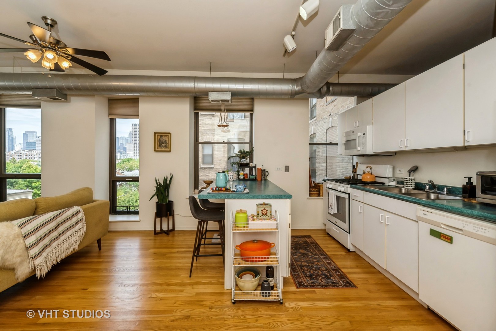 811 South Lytle Street, Unit 412 Chicago, IL 60607 - Photo 4 of 18 a kitchen with stainless steel appliances granite countertop a stove and white cabinets