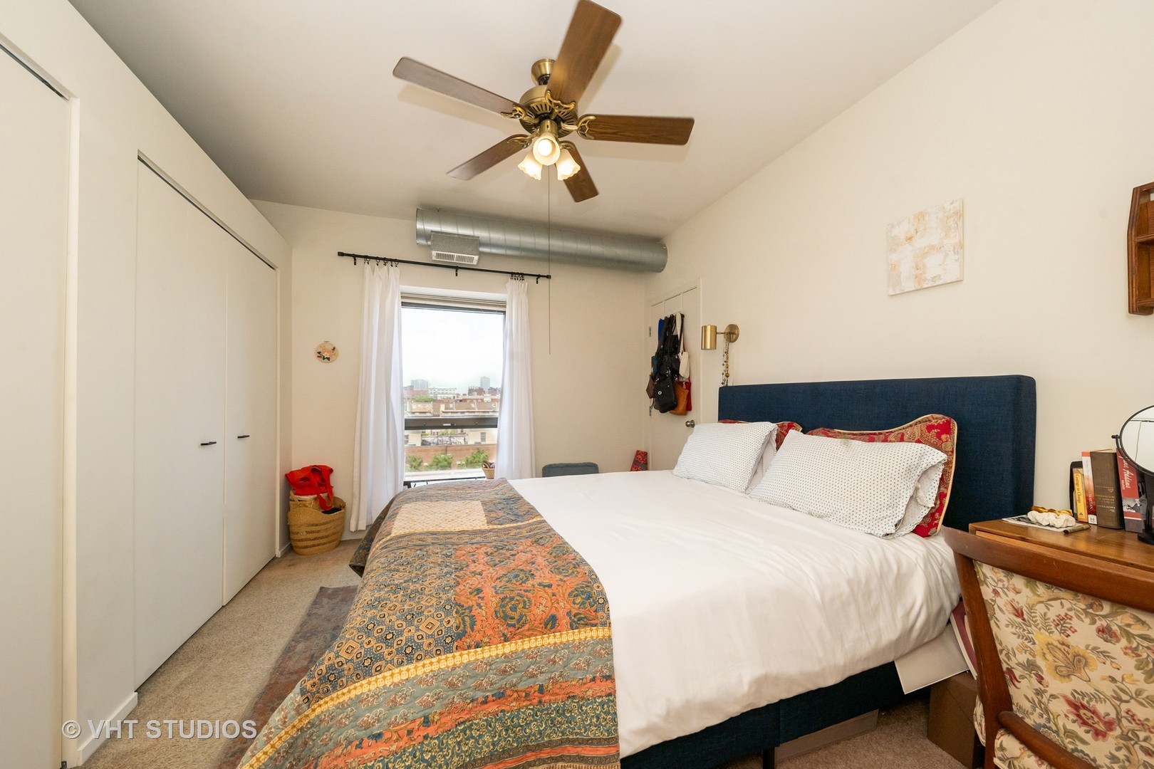 811 South Lytle Street, Unit 412 Chicago, IL 60607 - Photo 7 of 18 a bedroom with a bed and wooden floor
