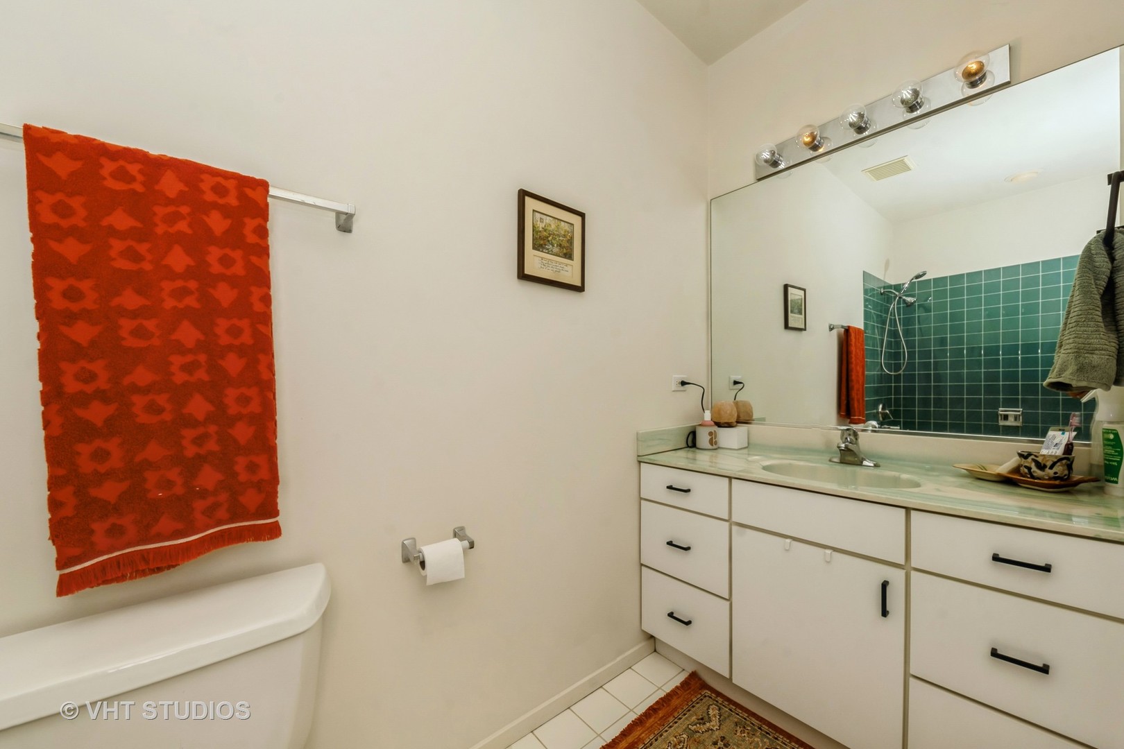 811 South Lytle Street, Unit 412 Chicago, IL 60607 - Photo 10 of 18 a bathroom with a double vanity sink toilet and shower