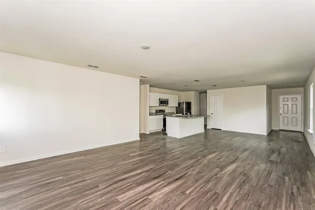 a view of kitchen with wooden floor
