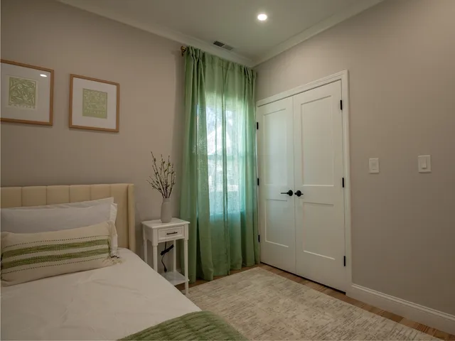 a bedroom with a bed and a view of bathroom