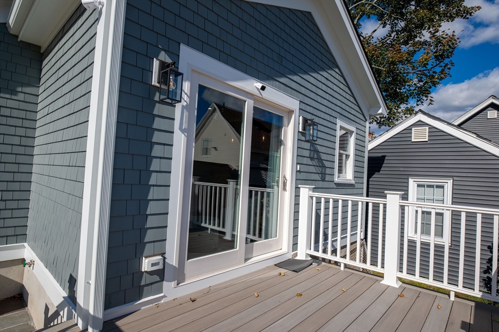 93 Grove Street, Unit 1R Fall River, MA 02720 - Photo 18 of 21 a view of a house and wooden deck