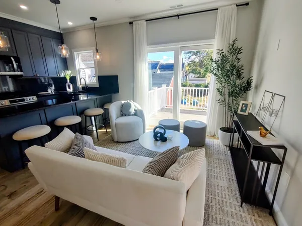 a living room with furniture and a large window